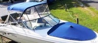 Photo of Rinker 272 Bowrider, 2001: Bimini Top, Front Connector, Side Curtains, Bow Cover, viewed from Starboard Front, Above 