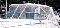 Photo of Rinker 280 Express Cruiser NO Arch, 2008: Bimini Top, Front Connector Bimini, Side and, Rear Side Curtain Sets Aft Curtains White Stamoid, viewed from Port Front 