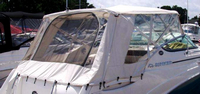 Photo of Rinker 280 Express Cruiser NO Arch, 2008: Bimini Top, Front Connector Bimini, Side and, Rear Side Curtain Sets Aft Curtains White Stamoid, viewed from Starboard Rear 