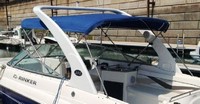 Photo of Rinker 282 Bow Rider, 2006: Factory Radar Arch Bimini Top at dock, viewed from Port Rear 