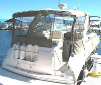 Photo of Rinker 320 Fiesta Vee, 2005: Bimini Top, Front Connector, Side Curtains, Camper Top, Camper Side Aft Curtains open, viewed from Starboard Rear 