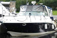 Photo of Rinker 320 Fiesta Vee, 2005: Bimini Connection Connector, Side Curtains, Camper Top Connection, Side Aft Curtains, viewed from Port Front 