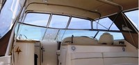 Photo of Rinker 410 Fiesta Vee Express Cruiser Canvas Tops, 2005: Bimini Top with Two, viewed from Port Hole Windows, Front Connector, Side Curtains, Inside 