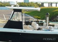 Photo of Robalo 240CC, 2006: Fiberglass T-Top, Front and, Side Enclosure Curtains, viewed from Port Side 