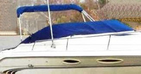 Photo of Sea Ray 240 Overnighter, 1997: Bimini Top in Boot, Cockpit Cover, viewed from Starboard Front 