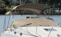 Photo of Sea Ray 260 Sundancer NO Arch, 1999: Bimini Top, Camper Top, Cockpit Cover with Bimini and Camper Top Cutouts, viewed from Starboard Front 