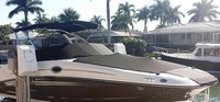 Photo of Sea Ray 300 Sundeck NO Tower, 2012: Bimini Top, Bow Cover Cockpit Cover, viewed from Starboard Front 