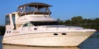 Photo of Sea Ray 420 Aft Cabin, 2000: Bridge Bimini Top and Enclosure Curtains, Aft Hard-Top, Side and Aft Curtains, viewed from Starboard Front 