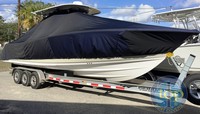 Sportsman® Open 312 T-Top-Boat-Cover-Elite-2549™ Custom fit TTopCover(tm) (Elite(r) Top Notch(tm) 9oz./sq.yd. fabric) attaches beneath factory installed T-Top or Hard-Top to cover boat and motors