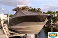 Photo of Edgewater 318CC, 2012: T-TopCover TTopCover™ T-Top boat cover on Lift Sunbrella Smoke Grey, viewed from Starboard Front  (Factory OEM) 