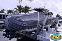 Photo of Edgewater 318CC, 2012: T-TopCover TTopCover™ T-Top boat cover on Lift Sunbrella Smoke Grey, viewed from Starboard Rear  (Factory OEM) 