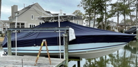 Photo of Jupiter 30CC 20xx LaPorte&trade; T-TopCover TTopCover&trade; T-Top boat cover, viewed from Starboard Side on lift from RnR-Marine&trade; 