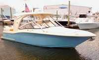 Photo of Scout 275 Dorado, 2015: Hard-Top, Connector, Side Curtains, viewed from Starboard Front 