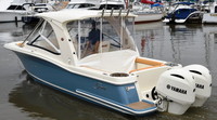 Photo of Scout 275 Dorado, 2020 Hard-Top, Connector, Side Curtains, Aft-Drop-Curtain White Stamoid, viewed from port rear 