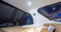 Photo of Factory OEM Sea Ray 540 Cockpit Motor Yacht, 2001: Bridge Hard-Top Full Enclosure, inside, rear   