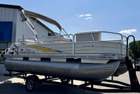 Photo of Tracker Sun Tracker Party Barge 18, 2007: Aft Bimini Top in Boot, viewed from Starboard Front 